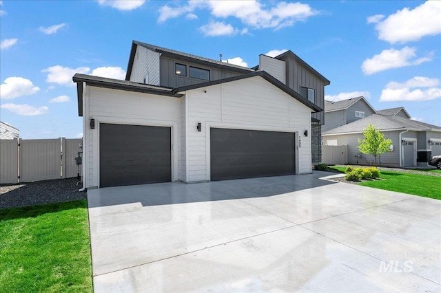 1499 W Blue Downs St, Meridian, ID 83642 - contemporary house featuring a garage, board and batten siding, driveway, fence, and a gate