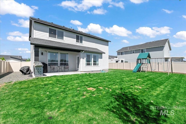 1499 W Blue Downs St, Meridian, ID 83642 - rear view of property with a patio area and a playground