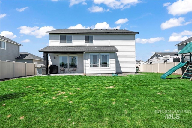 1499 W Blue Downs St, Meridian, ID 83642 - rear view of property featuring a playground and a patio