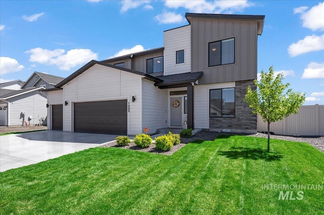 1499 W Blue Downs St, Meridian, ID 83642 - view of front of house featuring board and batten siding, an attached garage, driveway, and stone siding