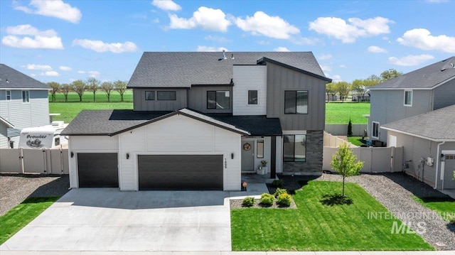 1499 W Blue Downs St, Meridian, ID 83642 - contemporary house featuring a gate, board and batten siding, concrete driveway, an attached garage, and roof with shingles