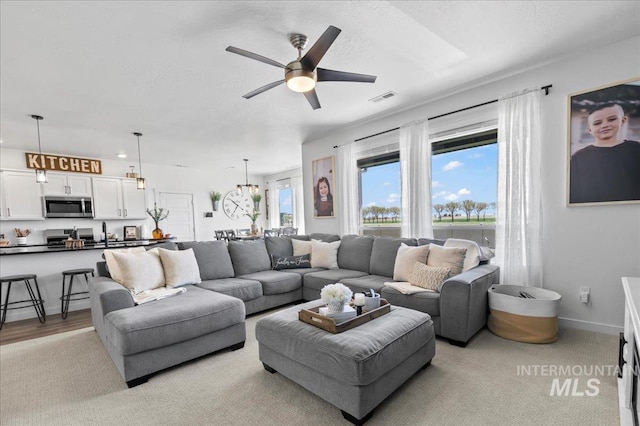1499 W Blue Downs St, Meridian, ID 83642 - living room featuring ceiling fan and baseboards