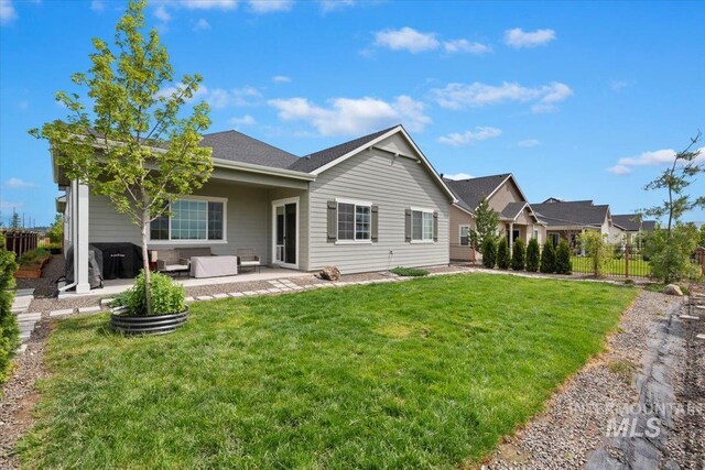 8291 W Corinthia St, Eagle, ID 83616 - back of house featuring an outdoor hangout area and a patio