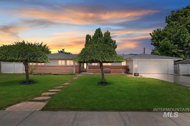 611 E Dewey Ln, Caldwell, ID 83607 - view of front of house with concrete driveway and an attached garage