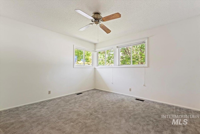 611 E Dewey Ln, Caldwell, ID 83607 - carpeted empty room featuring a ceiling fan and a textured ceiling
