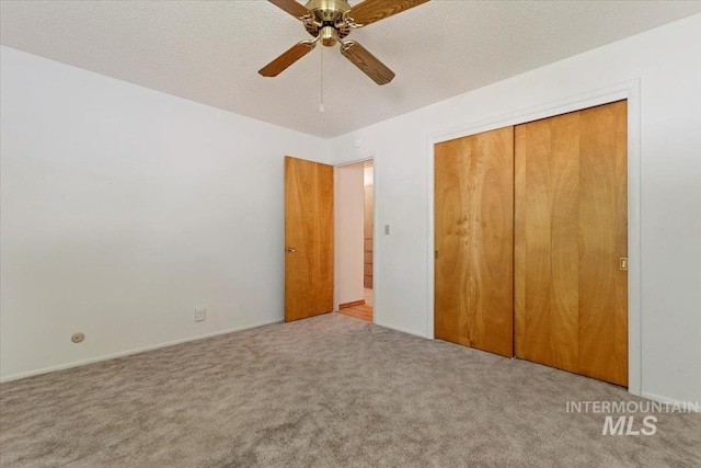 611 E Dewey Ln, Caldwell, ID 83607 - unfurnished bedroom with carpet, a closet, and ceiling fan