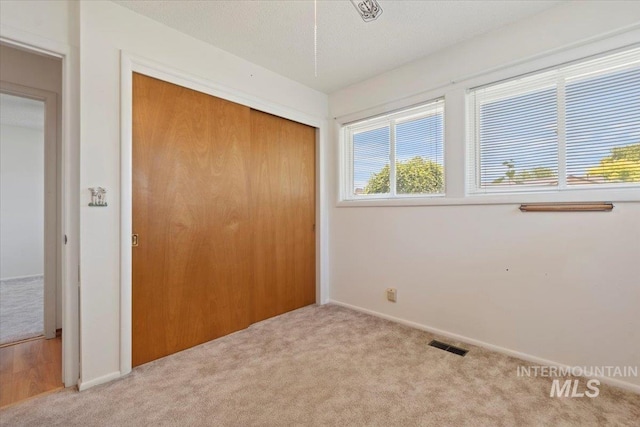 611 E Dewey Ln, Caldwell, ID 83607 - unfurnished bedroom with carpet flooring and a closet