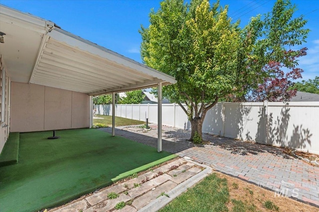 611 E Dewey Ln, Caldwell, ID 83607 - fenced backyard with a patio