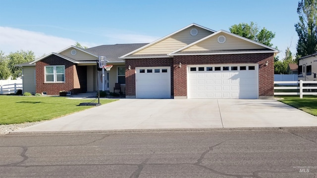 554 Valley Circle Rd, Hagerman, ID 83332 - view of front of house featuring an attached garage, brick siding, and concrete driveway
