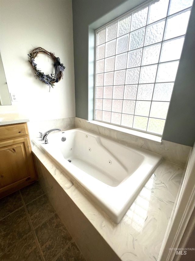 554 Valley Circle Rd, Hagerman, ID 83332 - full bath with vanity, a whirlpool tub, and tile patterned floors
