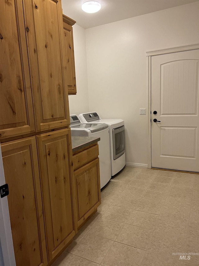 554 Valley Circle Rd, Hagerman, ID 83332 - laundry area with washer and dryer, cabinet space, baseboards, and light tile patterned floors