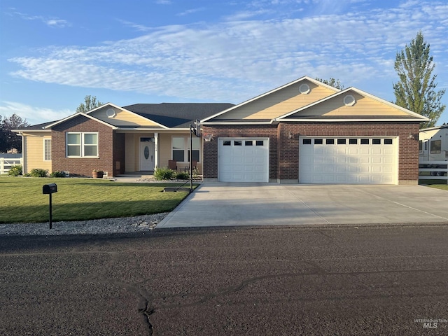 554 Valley Circle Rd, Hagerman, ID 83332 - single story home with an attached garage, concrete driveway, a front lawn, and brick siding
