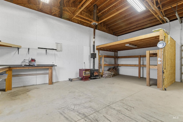 2245 Pitchstone Dr, Clarkston, WA 99403 - garage with a wood stove and a workshop area