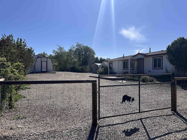 17121 Basey St, Murphy, ID 83650 - view of front of property with a gate and stucco siding