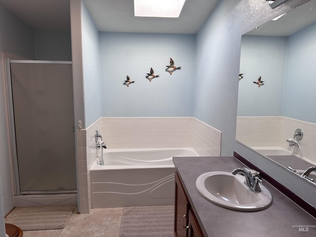 17121 Basey St, Murphy, ID 83650 - bathroom featuring a stall shower, vanity, a bath, and tile patterned flooring