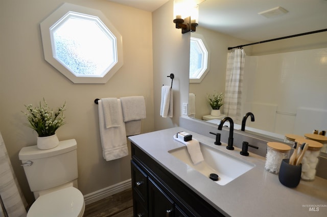 full bathroom with wood finished floors, vanity, baseboards, toilet, and a shower with shower curtain