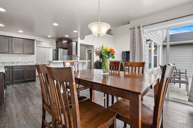 dining space featuring recessed lighting and dark wood finished floors