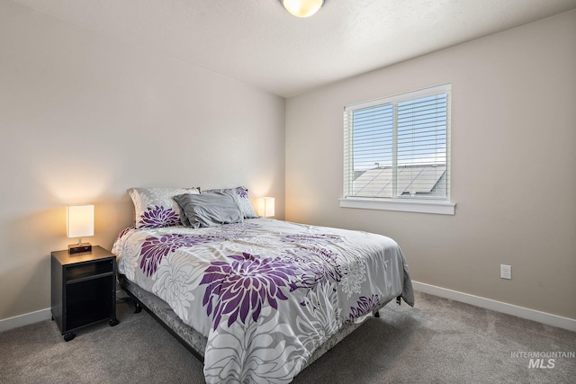 carpeted bedroom with baseboards
