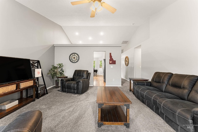 carpeted living area with baseboards, a ceiling fan, and lofted ceiling