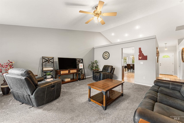 carpeted living room featuring baseboards, a ceiling fan, lofted ceiling, and visible vents