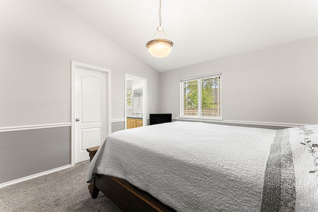 bedroom featuring baseboards, carpet flooring, and lofted ceiling