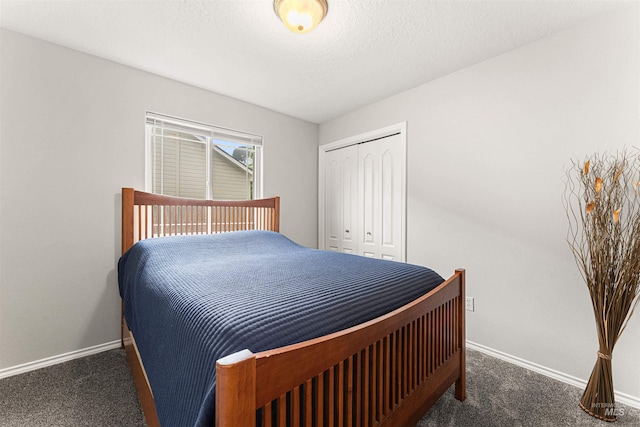 bedroom with baseboards, carpet, and a closet