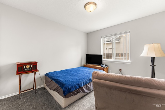 bedroom featuring carpet floors and baseboards