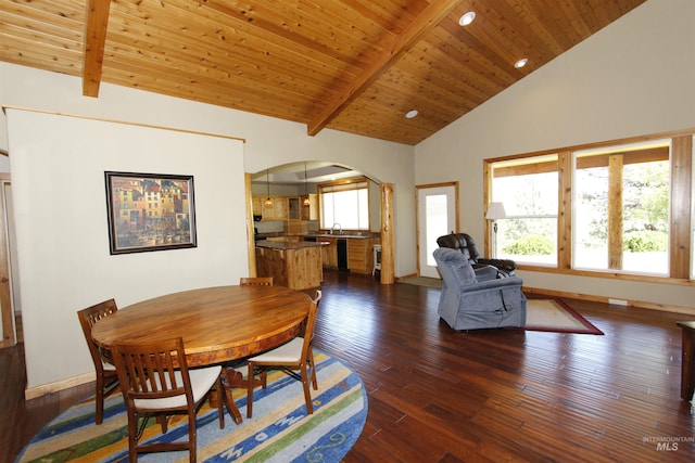 19801 Pinehaven Ln, Lenore, ID 83541 - dining area with arched walkways, dark wood-type flooring, a wood ceiling with exposed beams, and high vaulted ceiling