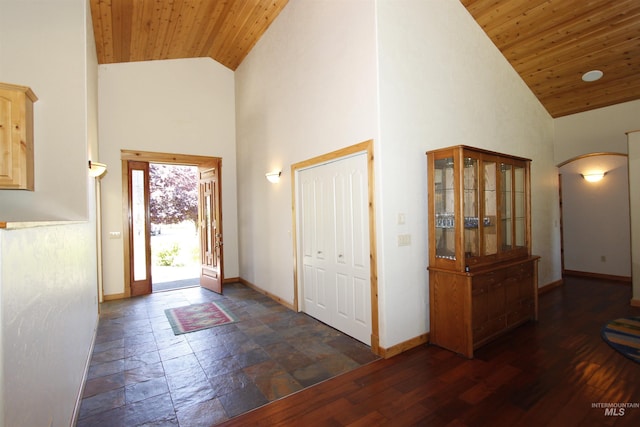 19801 Pinehaven Ln, Lenore, ID 83541 - entrance foyer featuring high vaulted ceiling, arched walkways, wood ceiling, and stone tile flooring
