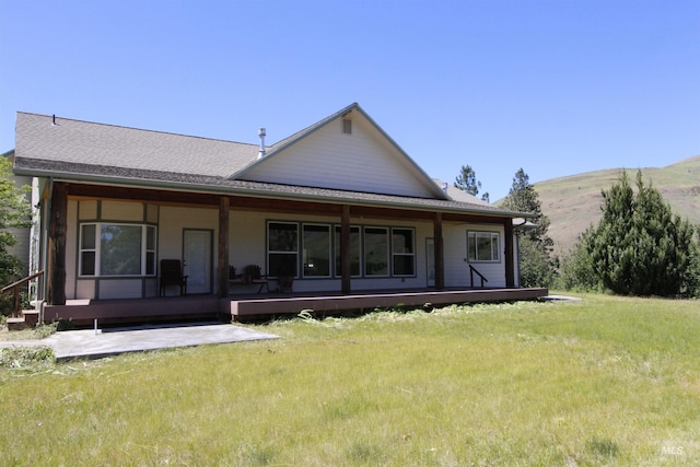 19801 Pinehaven Ln, Lenore, ID 83541 - rear view of property with a yard and a mountain view