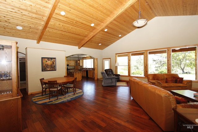 19801 Pinehaven Ln, Lenore, ID 83541 - living room featuring arched walkways, high vaulted ceiling, a wood ceiling with exposed beams, dark wood finished floors, and recessed lighting