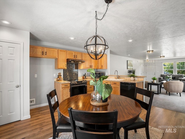 12800 W Fernleaf St, Boise, ID 83713 - dining space featuring a chandelier, a textured ceiling, dark wood-style flooring, and recessed lighting