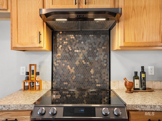12800 W Fernleaf St, Boise, ID 83713 - kitchen with stainless steel electric range oven, wall chimney exhaust hood, light countertops, and backsplash