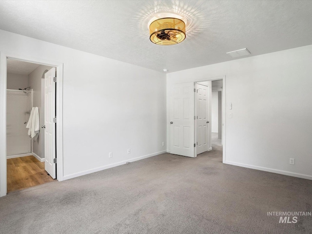 12800 W Fernleaf St, Boise, ID 83713 - unfurnished bedroom with carpet and a textured ceiling