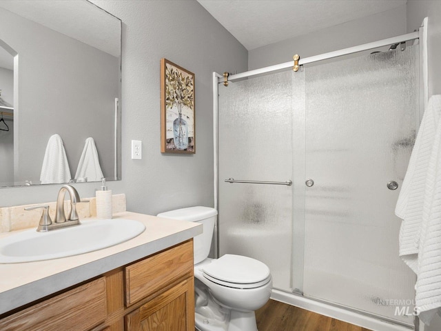 12800 W Fernleaf St, Boise, ID 83713 - full bath featuring a shower stall, wood finished floors, and vanity