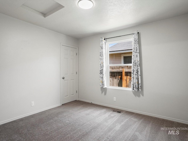 12800 W Fernleaf St, Boise, ID 83713 - carpeted empty room featuring attic access and baseboards