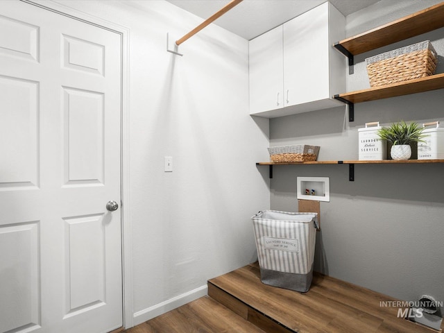 12800 W Fernleaf St, Boise, ID 83713 - laundry area featuring hookup for a washing machine, cabinet space, and wood finished floors