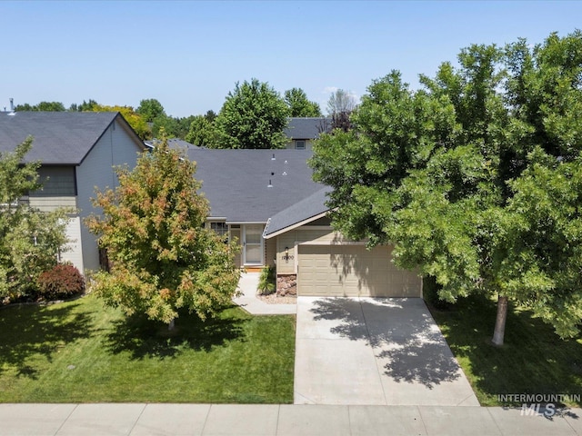 12800 W Fernleaf St, Boise, ID 83713 - obstructed view of property with concrete driveway, a front yard, a garage, and stone siding