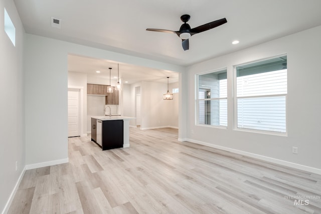 3604 W Meadowpine St, Meridian, ID 83642 - kitchen featuring open floor plan, appliances with stainless steel finishes, tasteful backsplash, and ceiling fan