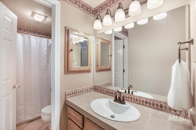 255 Los Lagos, Twin Falls, ID 83301 - bathroom featuring tile patterned floors, vanity, toilet, and a shower with curtain