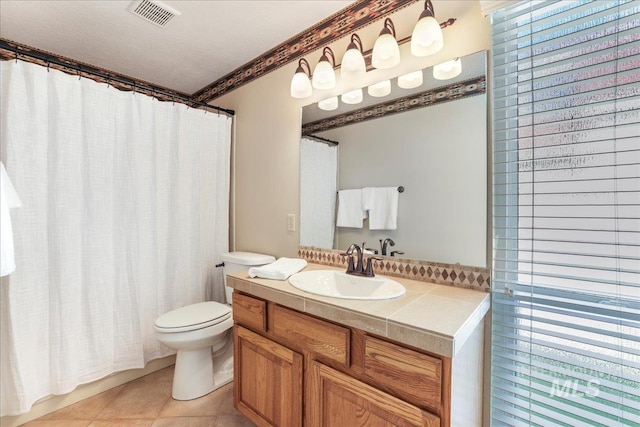255 Los Lagos, Twin Falls, ID 83301 - full bath with toilet, vanity, and tile patterned flooring