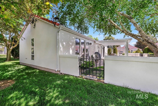 255 Los Lagos, Twin Falls, ID 83301 - view of property exterior featuring stucco siding, a pergola, and a gate