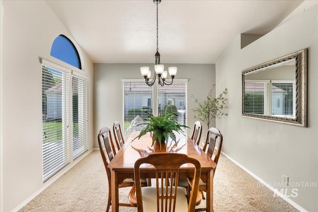255 Los Lagos, Twin Falls, ID 83301 - dining space with carpet, a chandelier, baseboards, and a textured ceiling