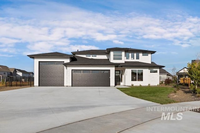 prairie-style house featuring a front yard