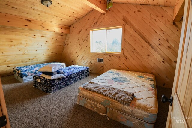 bedroom featuring wooden ceiling, wooden walls, and hardwood / wood-style flooring