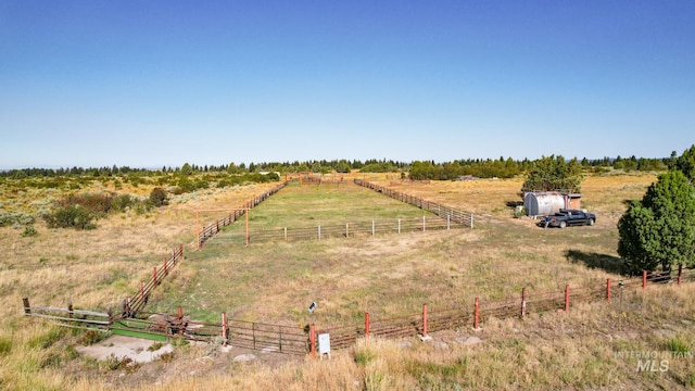 birds eye view of property featuring a rural view