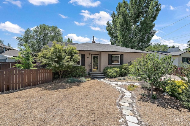 3209 W Plant Dr, Boise, ID 83703 - view of front of home with stucco siding and roof with shingles