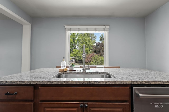 3209 W Plant Dr, Boise, ID 83703 - kitchen featuring a sink, dishwasher, and light stone counters