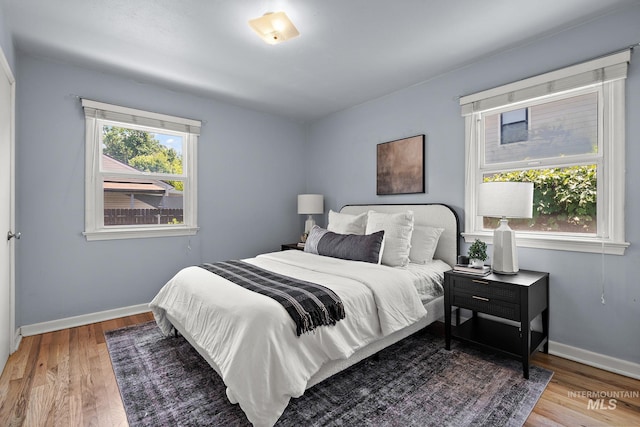 3209 W Plant Dr, Boise, ID 83703 - bedroom featuring wood finished floors and baseboards