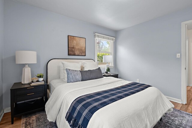 3209 W Plant Dr, Boise, ID 83703 - bedroom featuring wood finished floors and baseboards